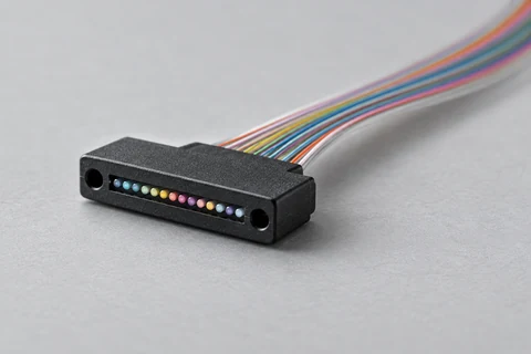 Conceptual multi-fibre ferrule and ribbon. Geometry and optical endpoints are simplified; not a connector specification.
