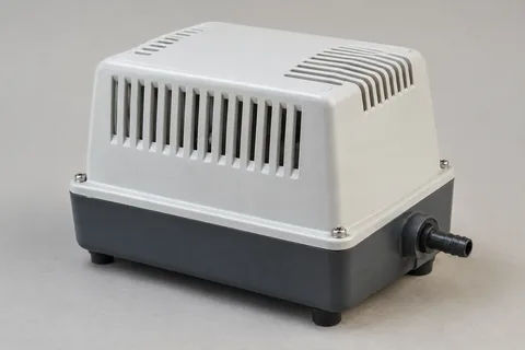 compact linear electromagnetic diaphragm air pump with rectangular ventilated housing and a hose outlet